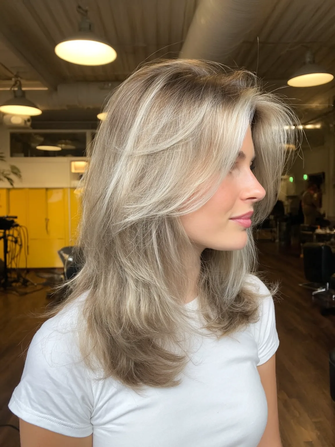 Medium Voluminous Ash Blonde Wavy Layers with Curtain Bangs